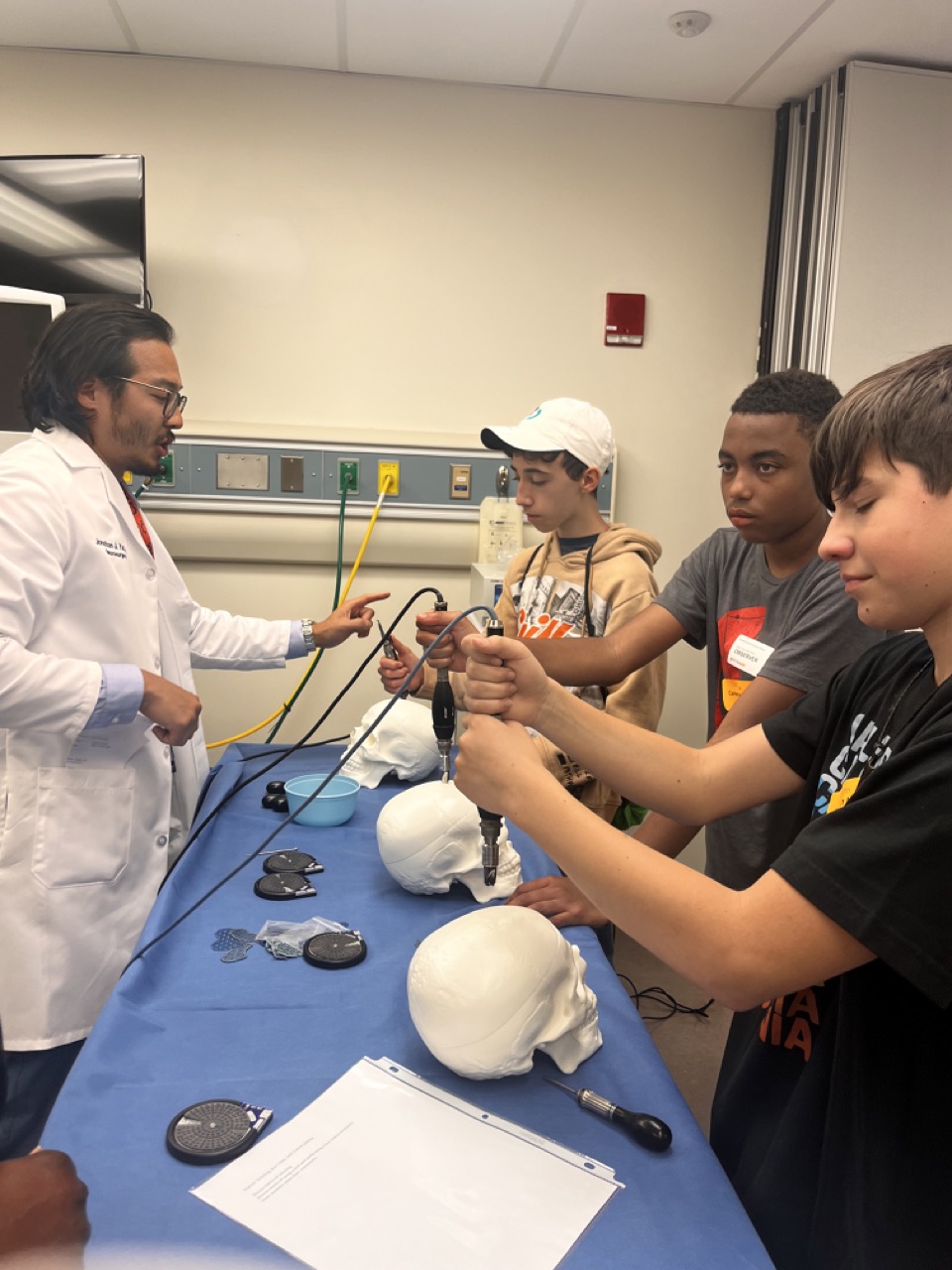 SHP Scholars explore a model human skull during the Health & Sciences Pathway with UVA Health.