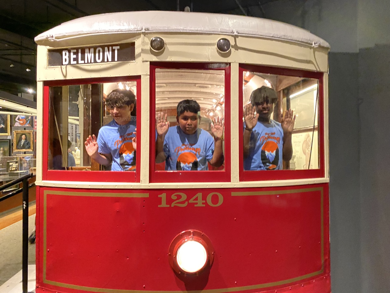 Students in a toy train