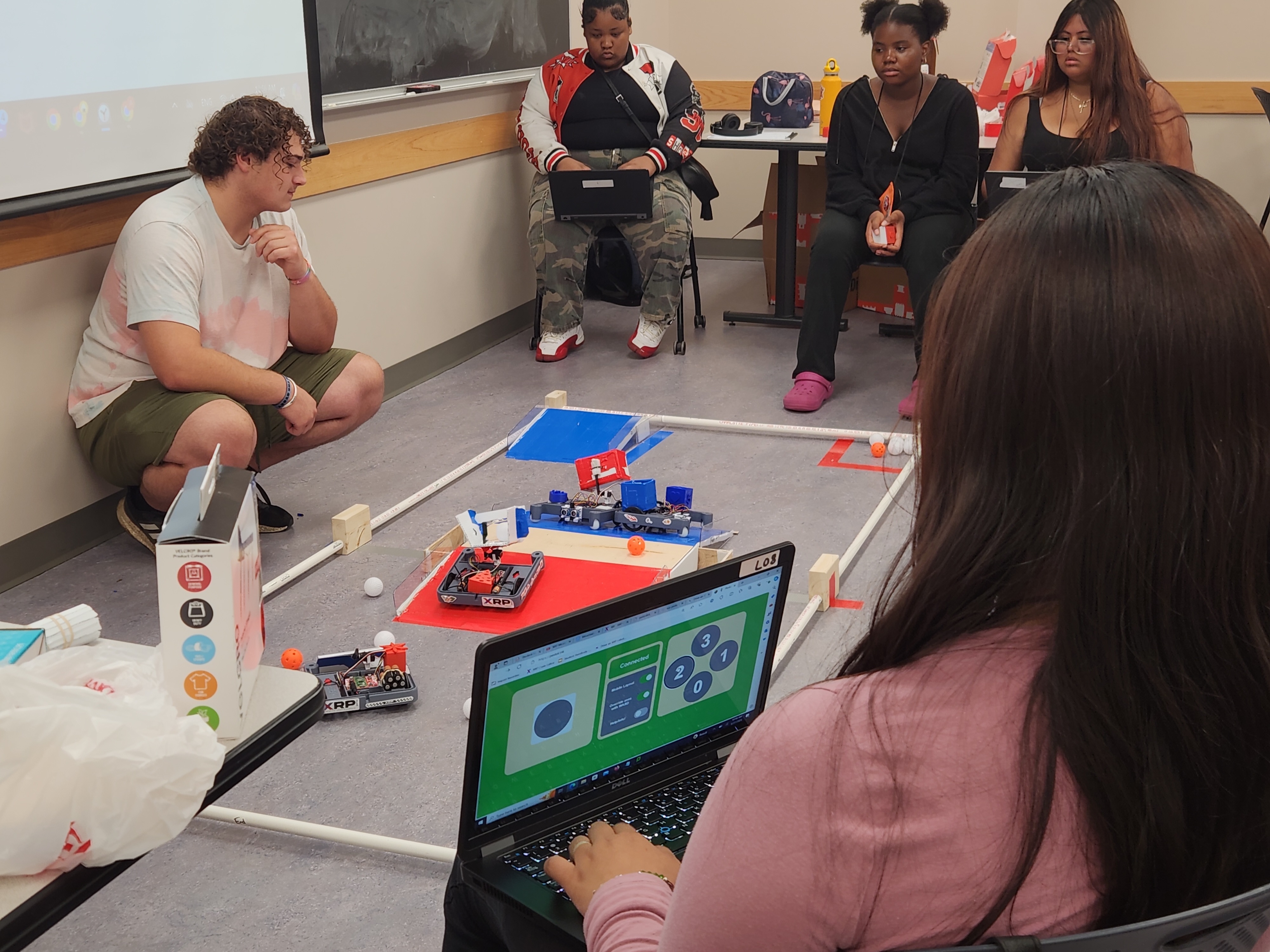 Students watch robotic models