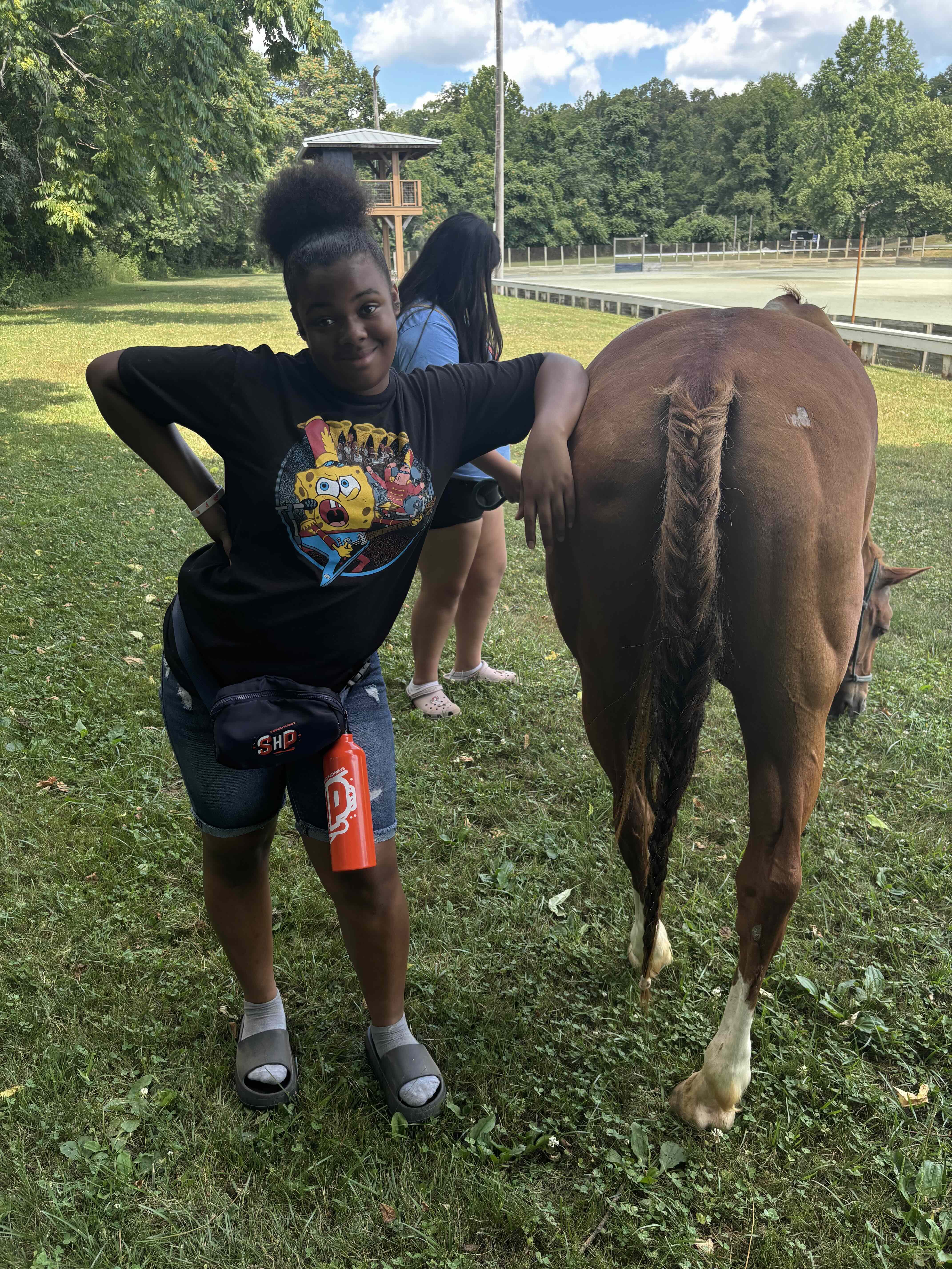 Student showing off their horse tail braiding skills