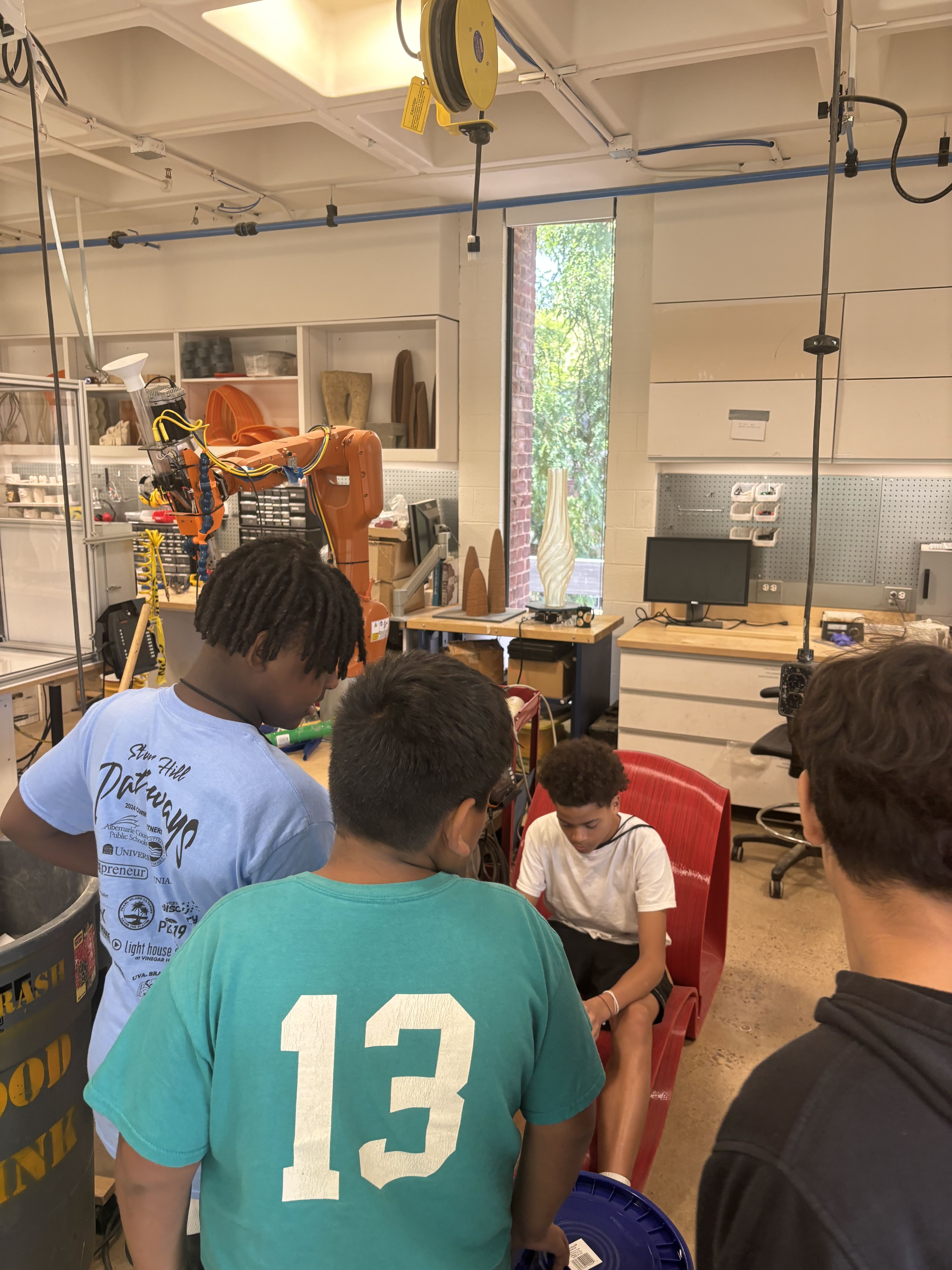 Scholars gather to look at an architecture model