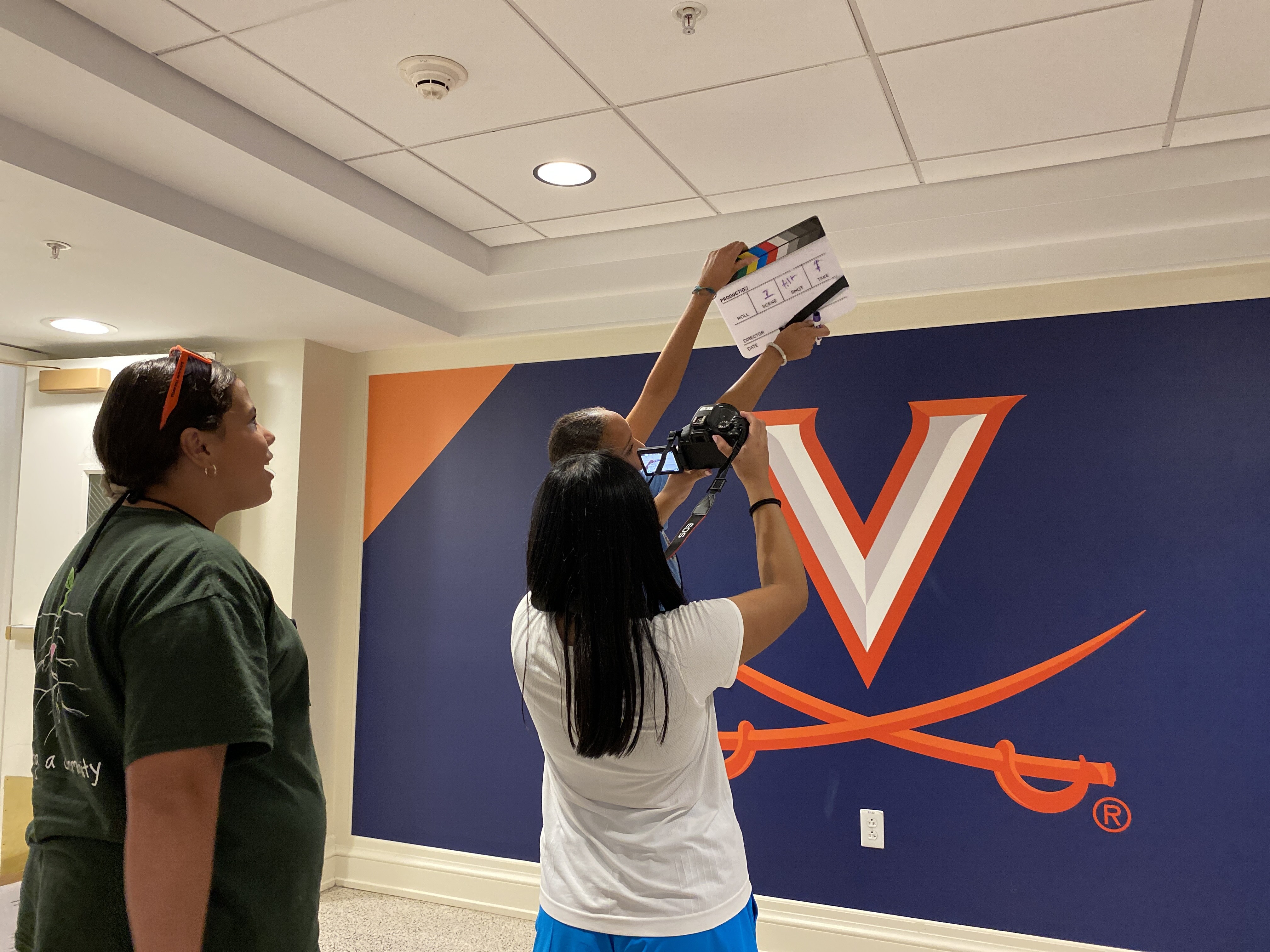 Students take a picture of the UVA V-Saber