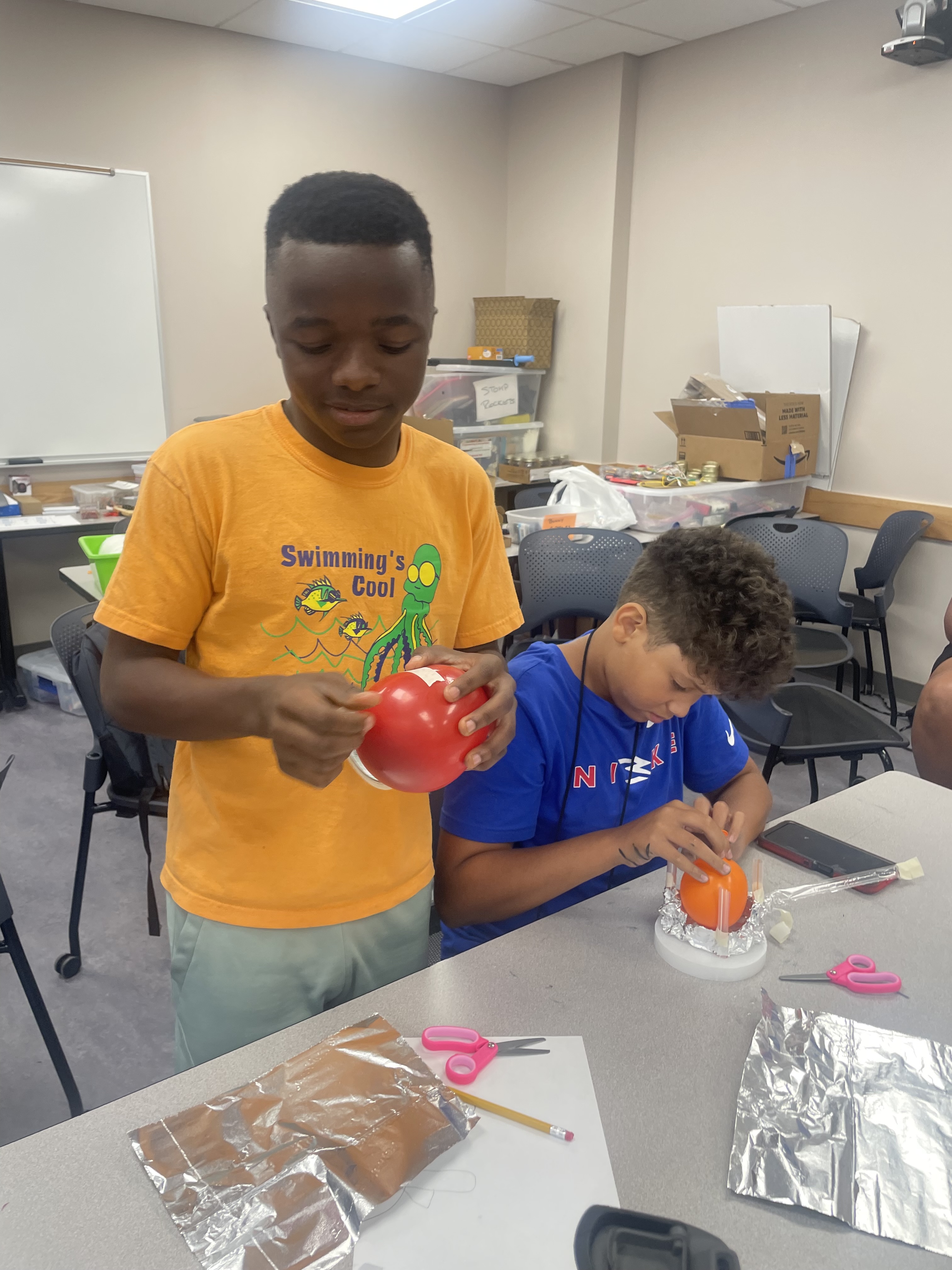 Students work on balloon model