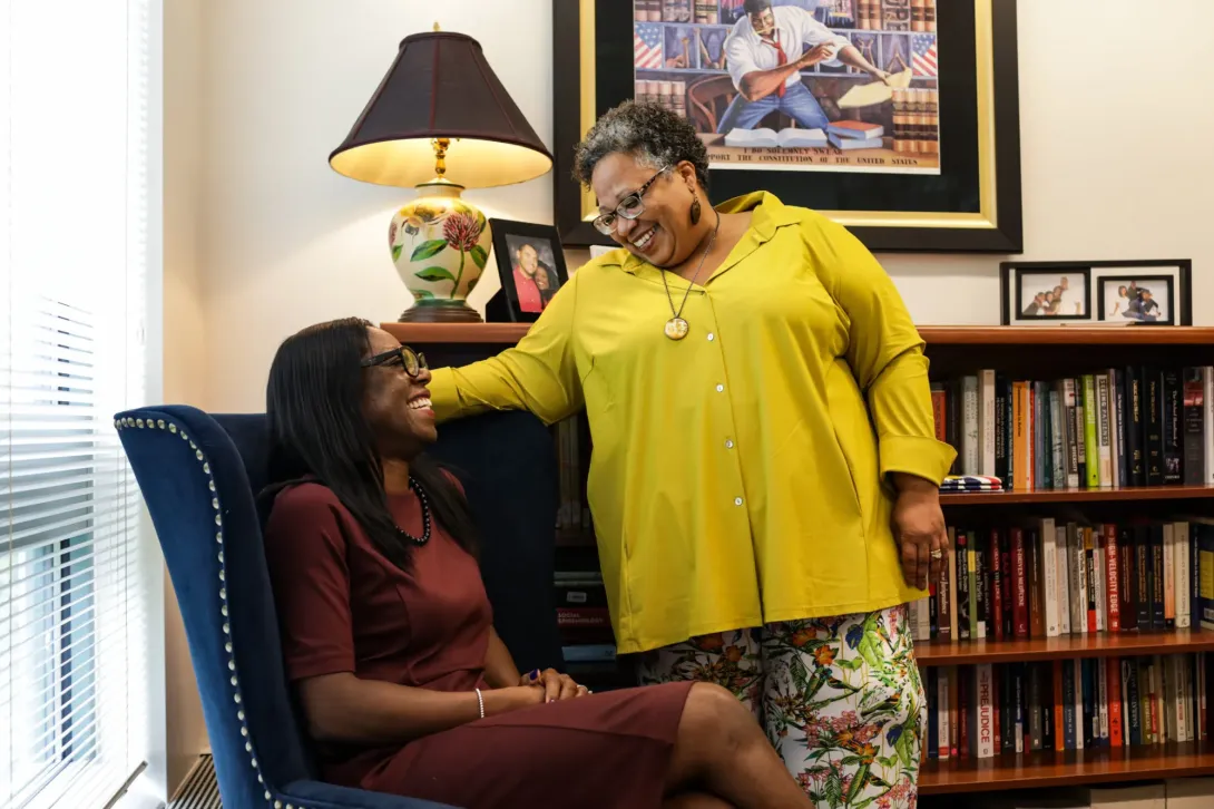 Women laughing in an office